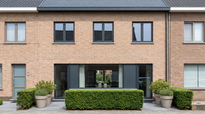 AFTER photo — textured anthracite RAL 7016 aluminium windows