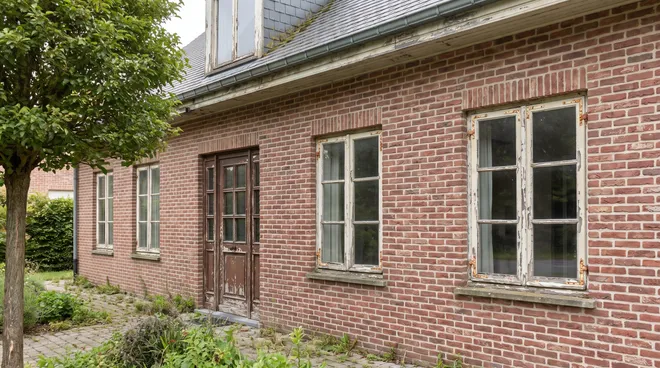 BEFORE photo — old single-glazed casement windows