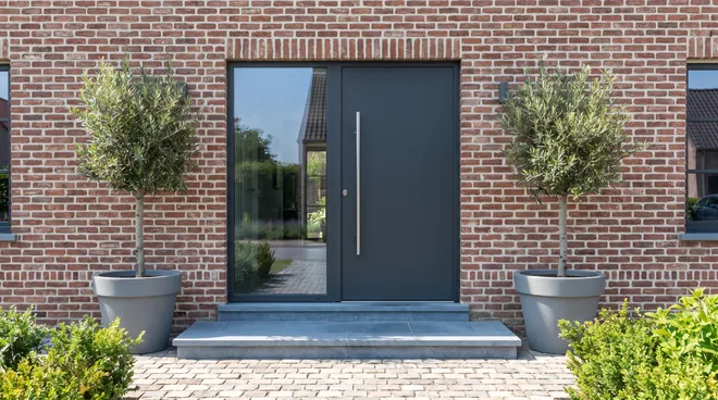 AFTER photo — design alu door with a stainless pull handle